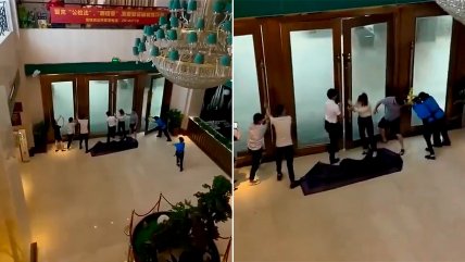   Trabajadores de hotel debieron afirmar puertas durante paso de super tifón en Vietnam 
